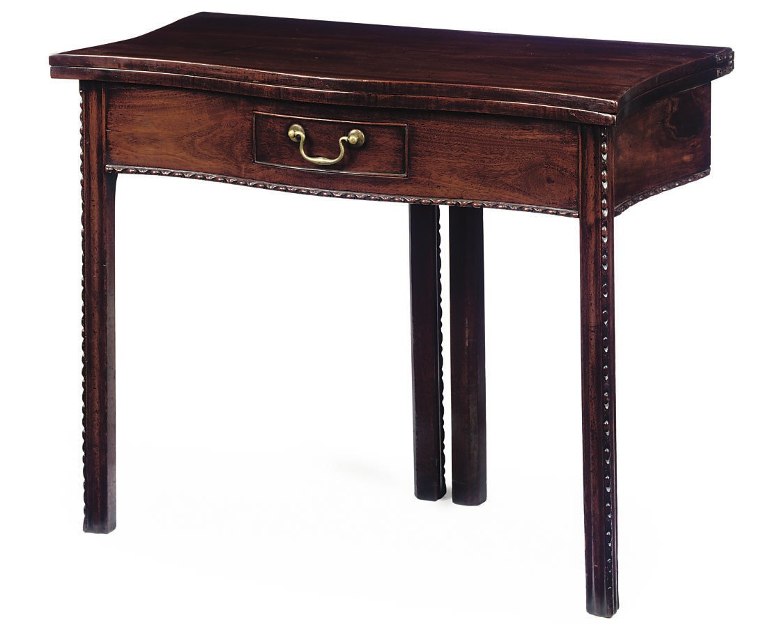 A GEORGE III MAHOGANY SERPENTINE CARD TABLE