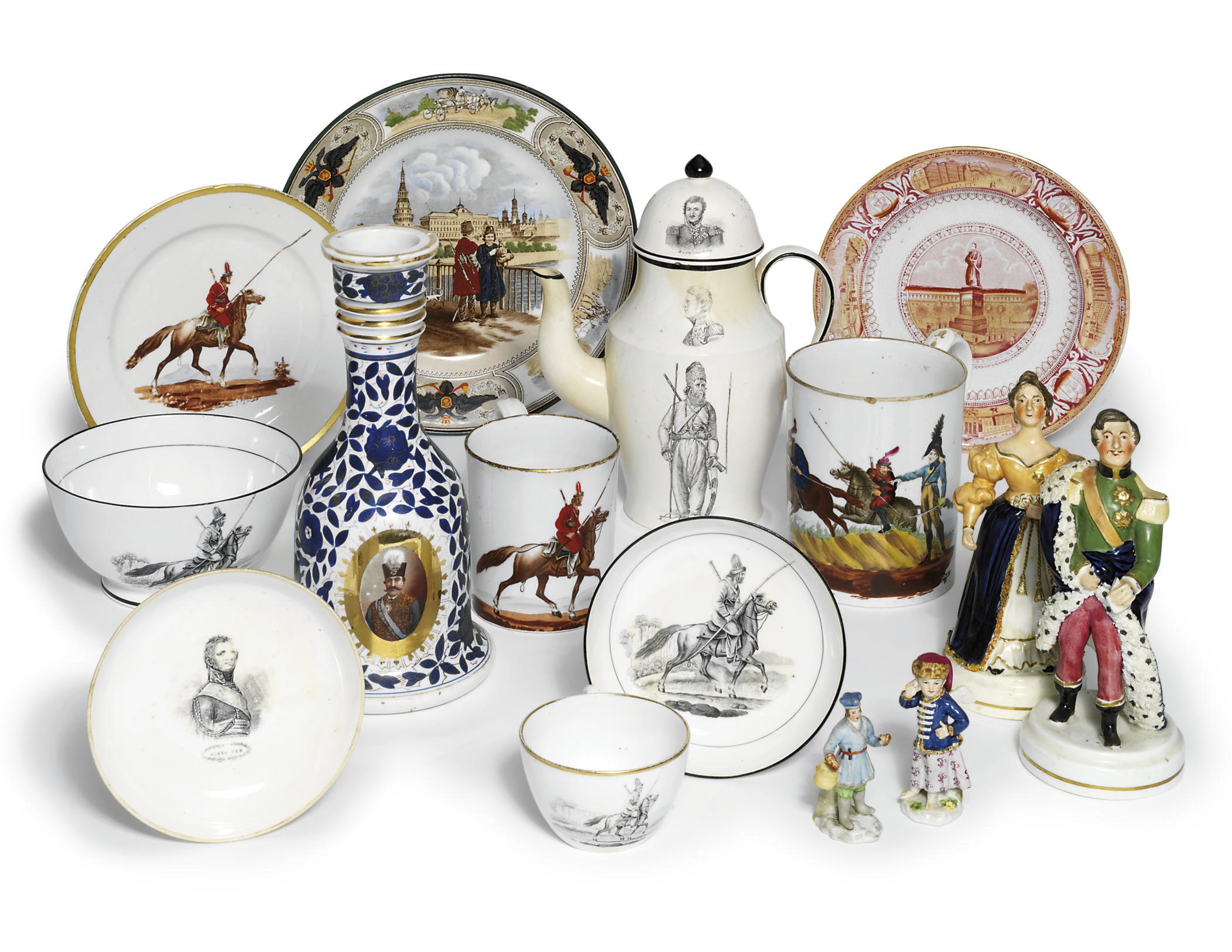 A ceramic group including a pair of rare porcelain figures