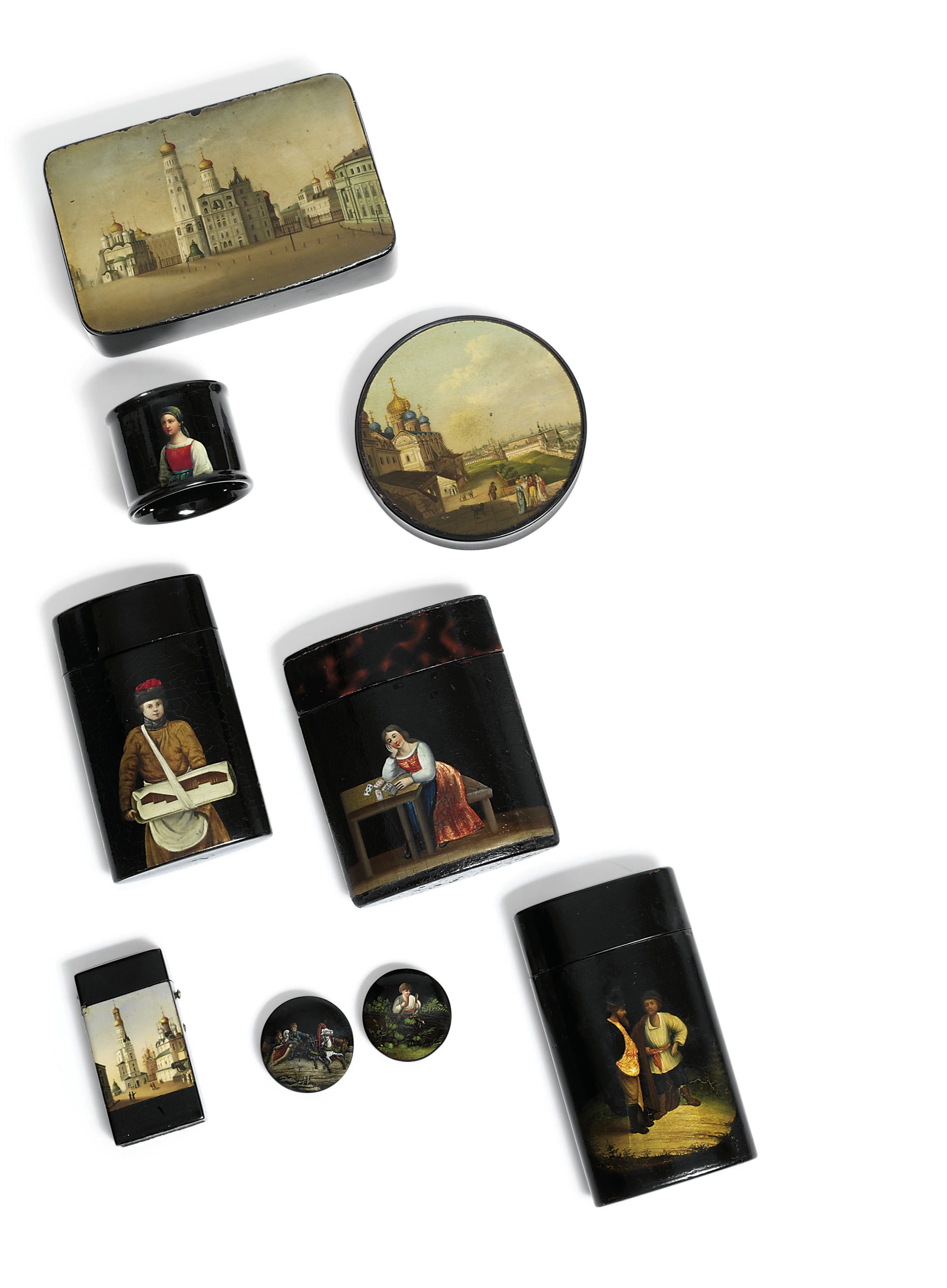 A group of papier-mâché lacquer including a snuff-box, three cheroot cases and a napkin ring