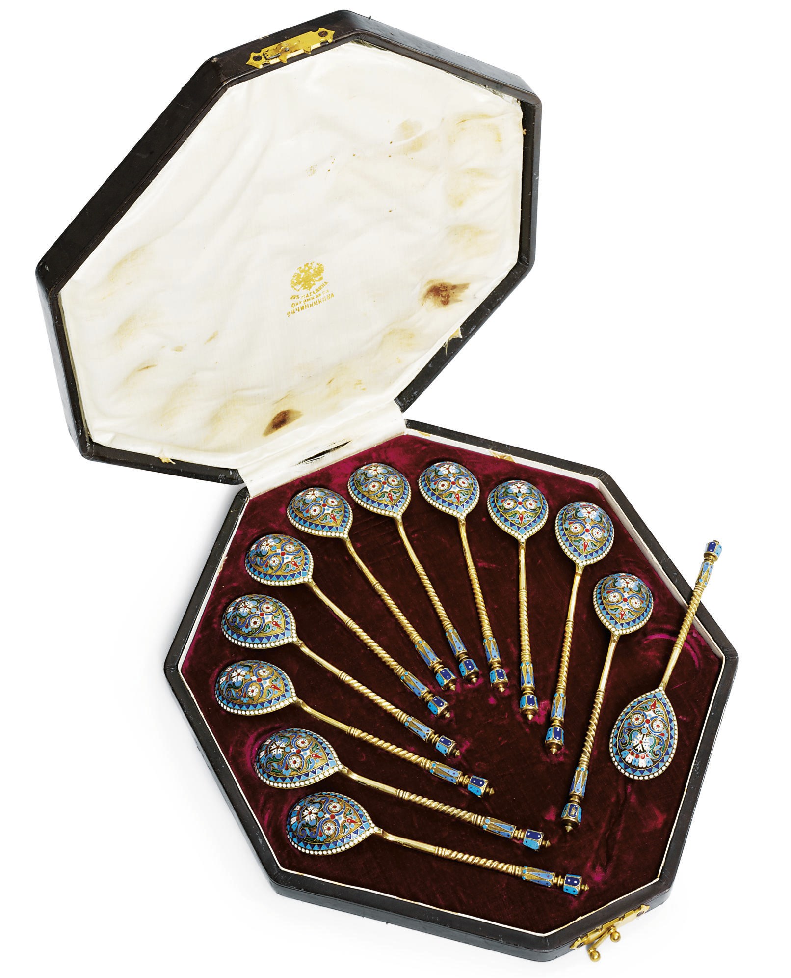 A set of twelve silver-gilt and cloisonné enamel tea-spoons