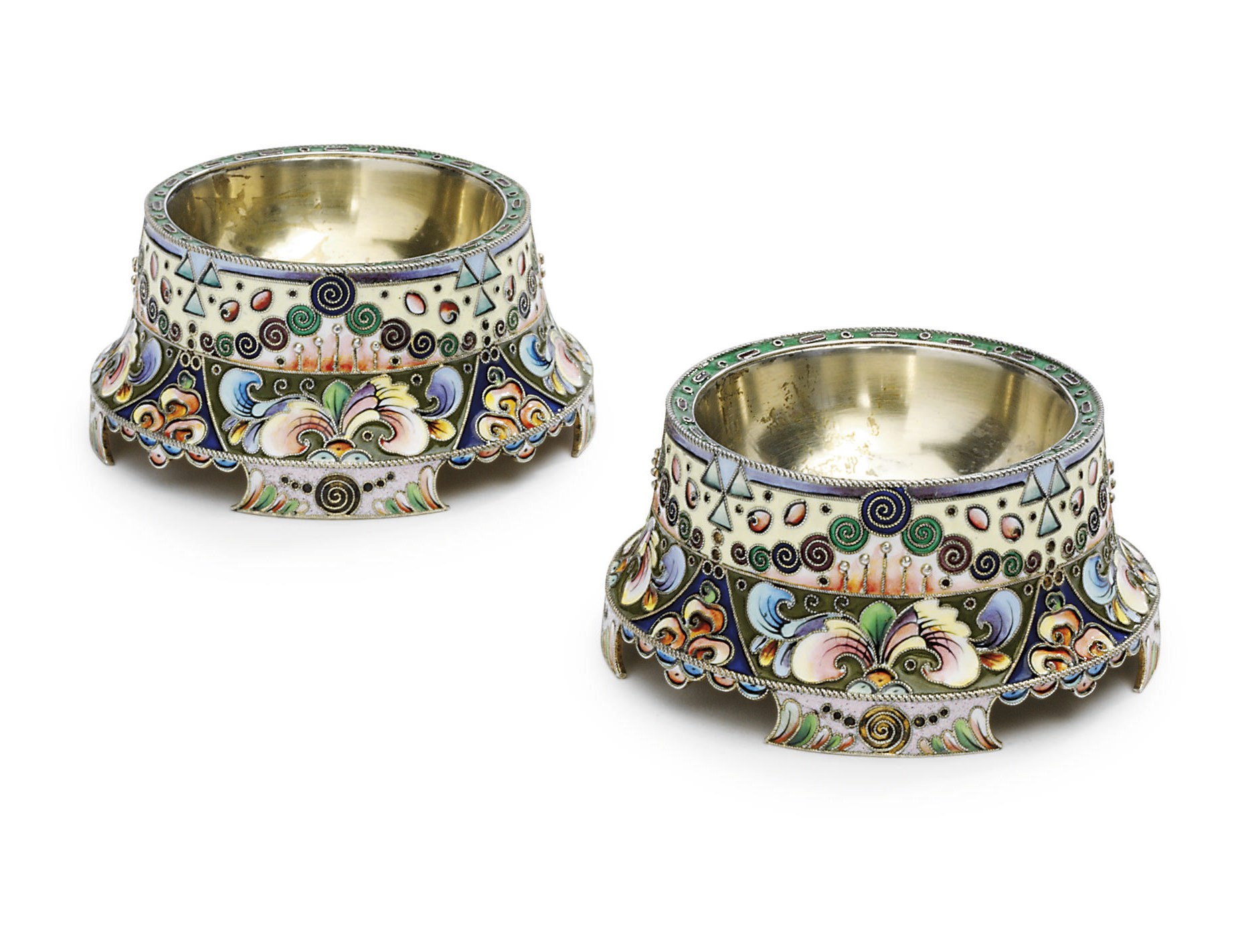 A pair of silver-gilt salt and pepper cellars
