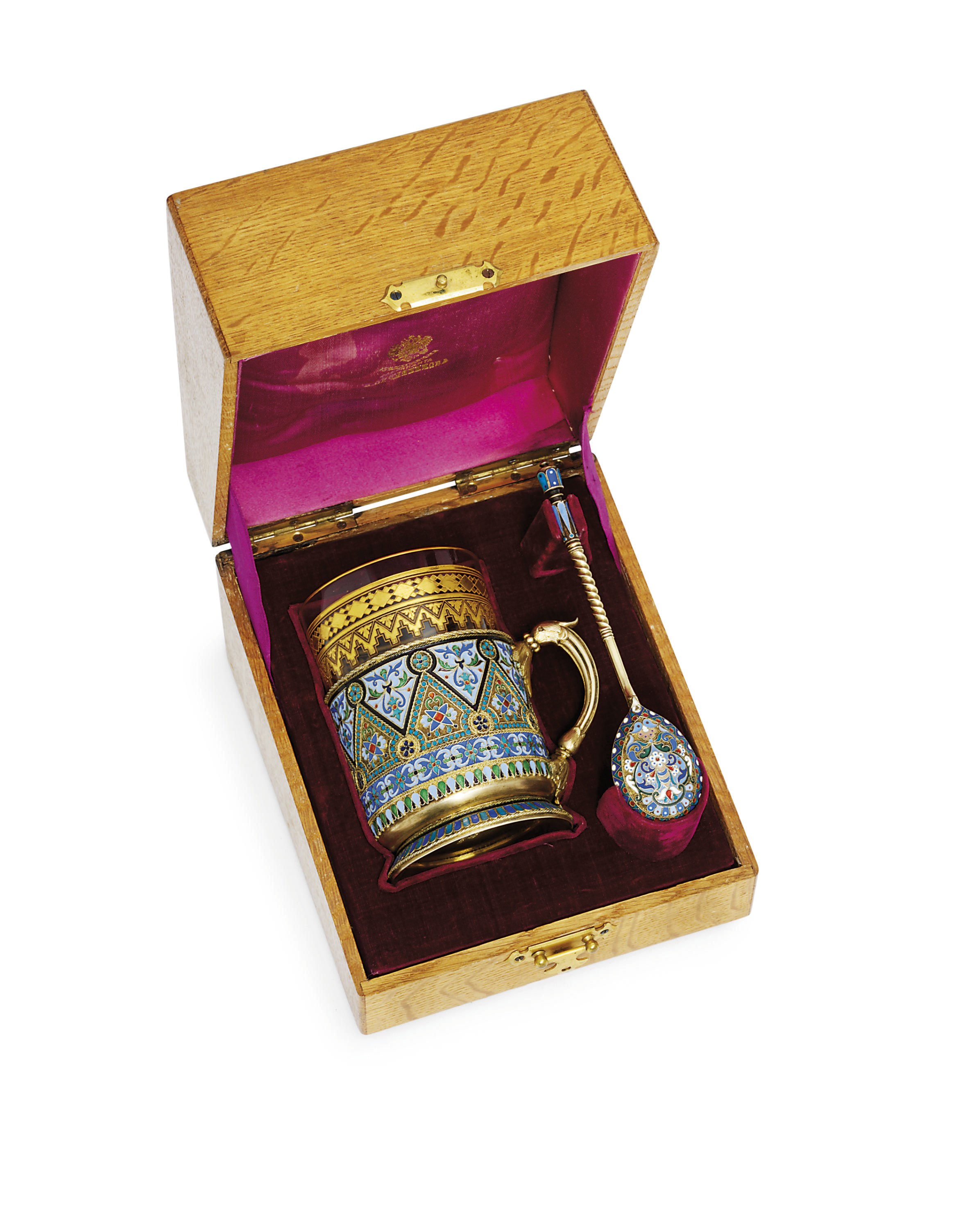 A silver-gilt and cloisonné enamel tea-glass holder and spoon