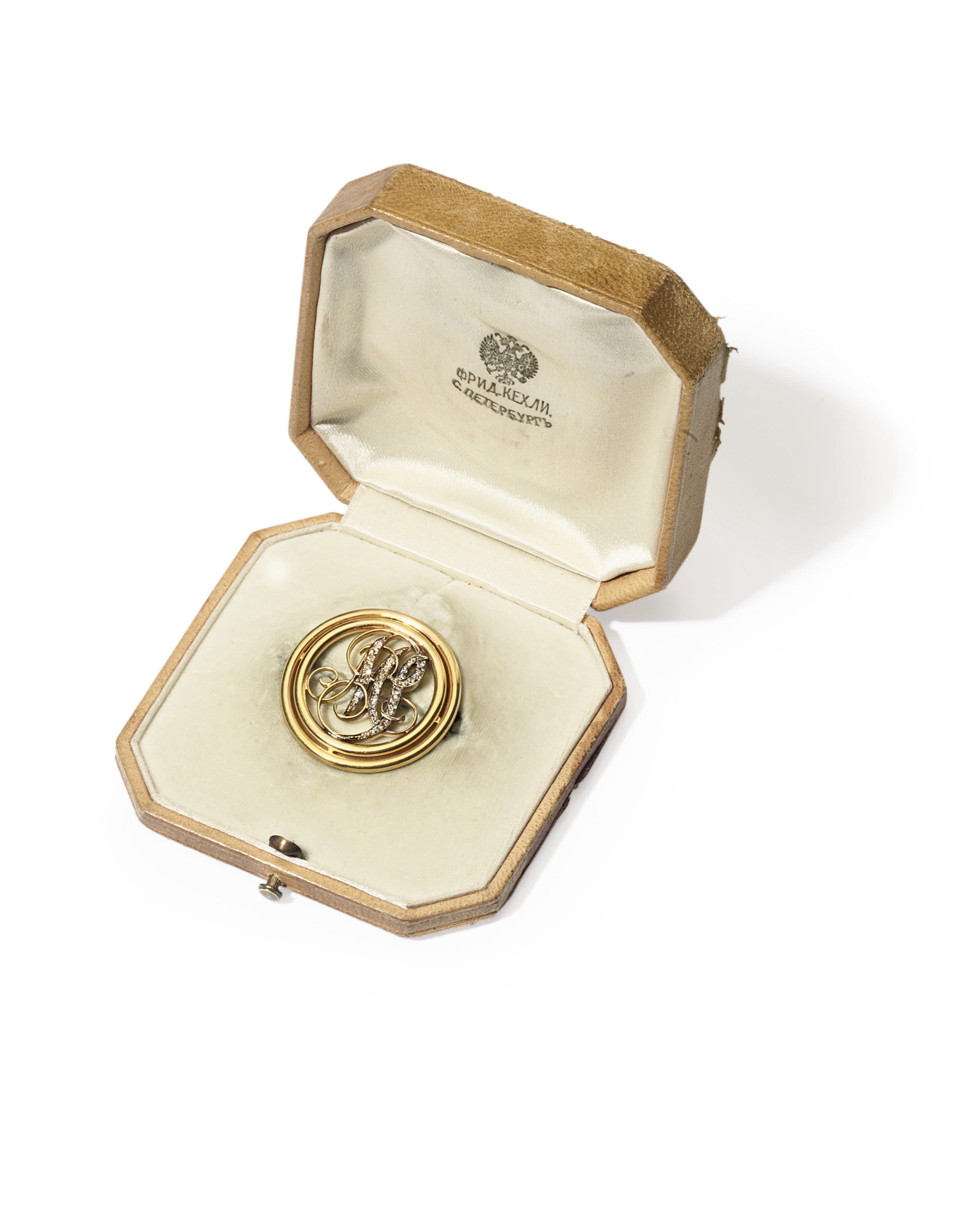 A diamond-set gold brooch