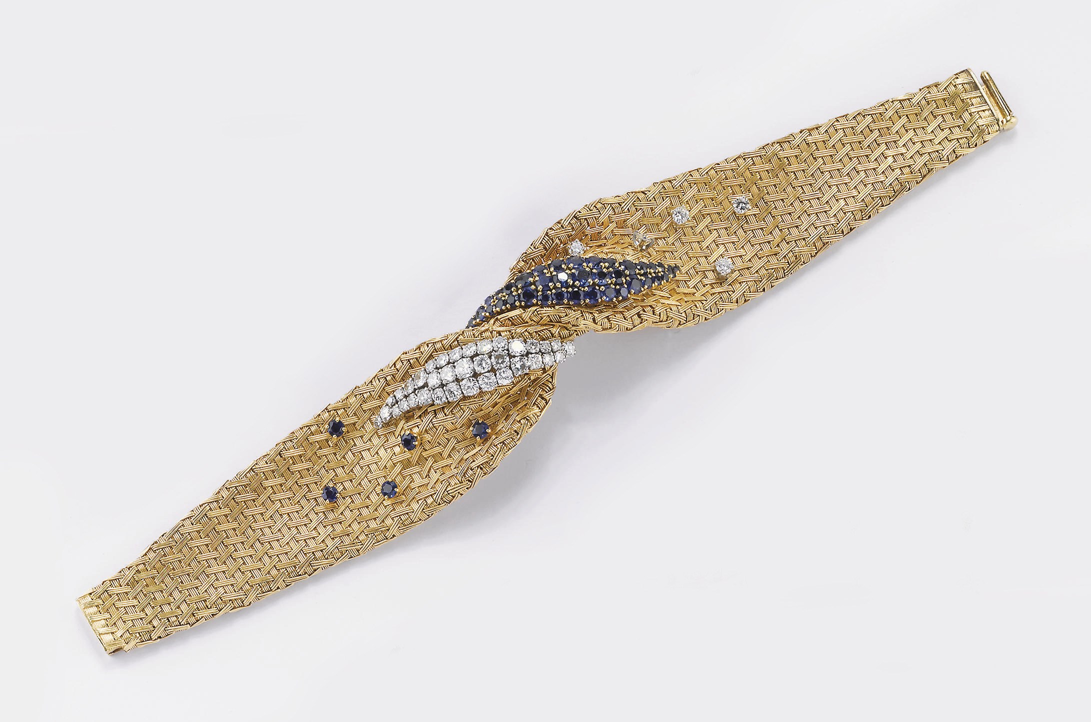 BRACCIALE A FASCIA SEMISNODATO IN ORO, ZAFFIRI E DIAMANTI