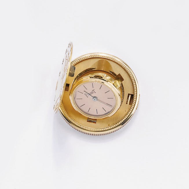 OROLOGIO A MONETA IN ORO GIALLO, PIAGET