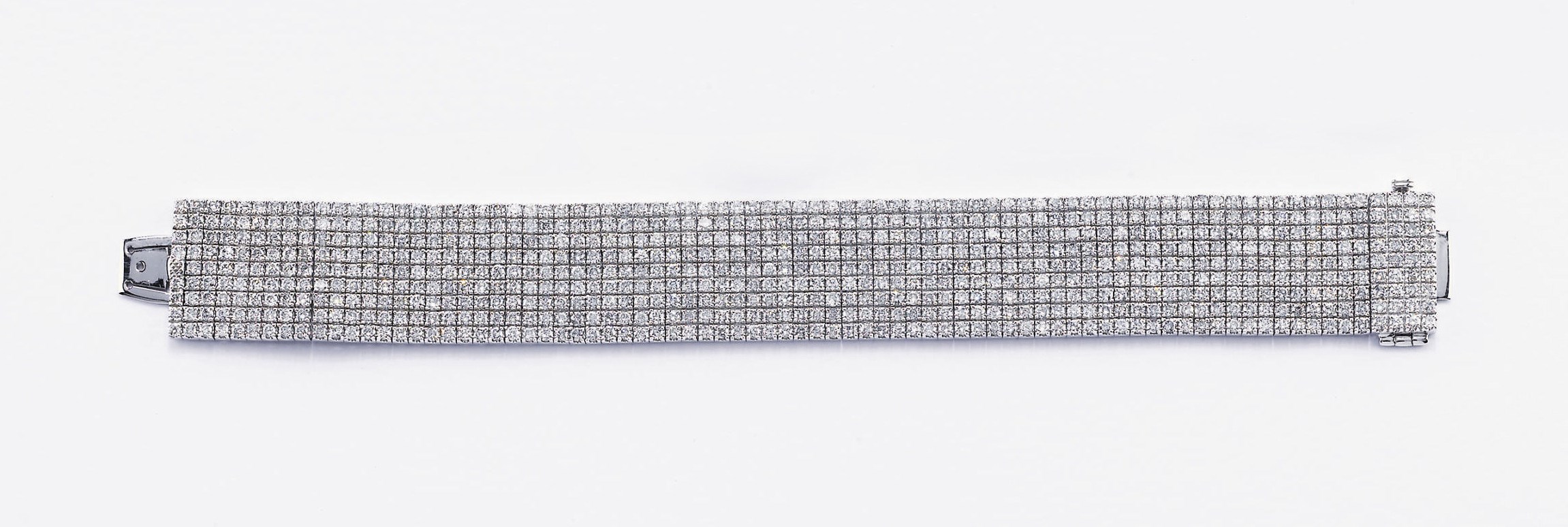 BRACCIALE A FASCIA SEMISNODATO IN ORO E DIAMANTI