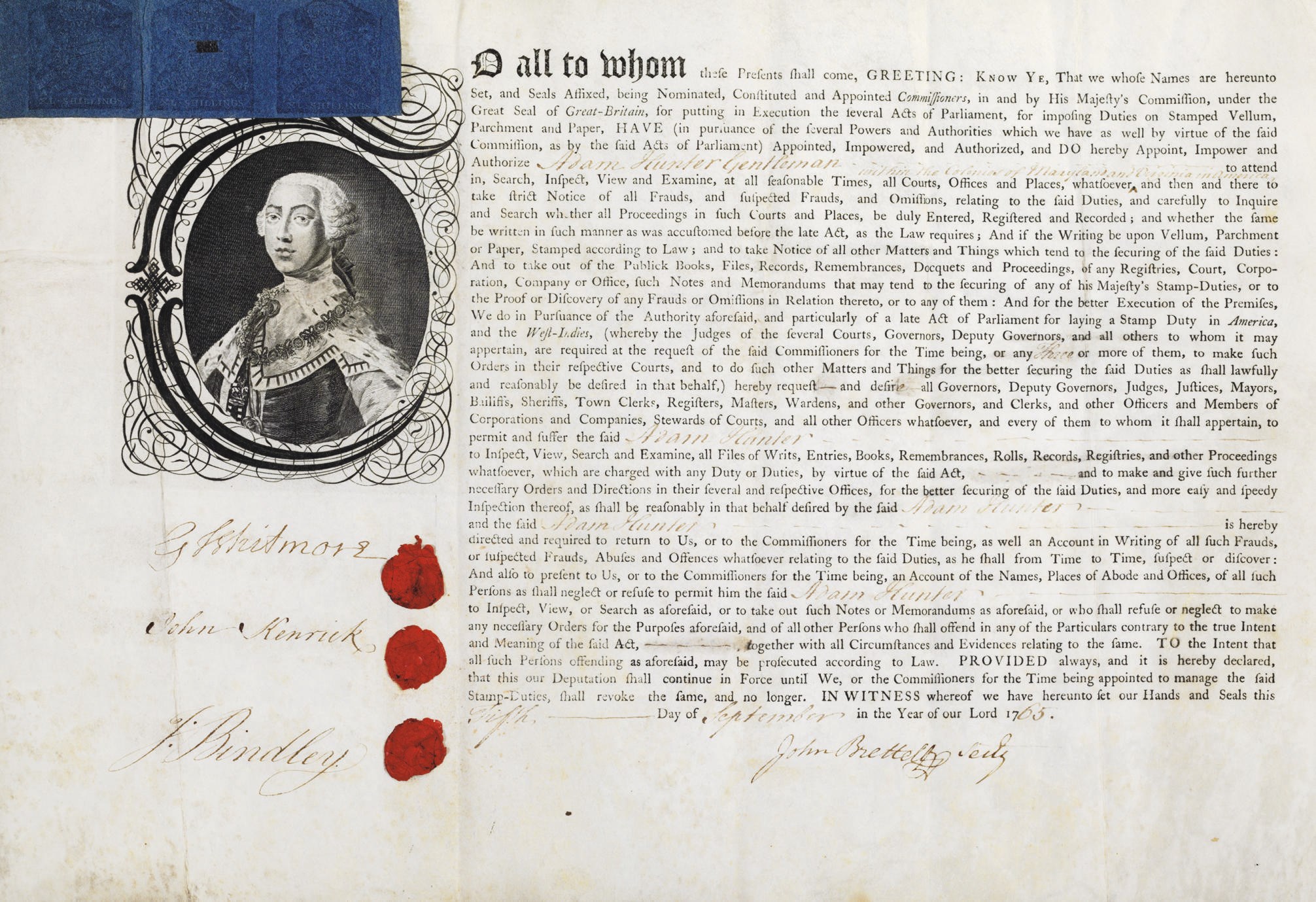 [REVOLUTIONARY WAR]. [STAMP ACT]. Partly printed document signed ("G. Whitmore," "John Kenrick," and "J. Bindley"), as Royal Commissioners, London, 5 September 1765. 1 page, folio (11½ x 16 in.), ON PARCHMENT, large gothic initial capital enclosing engraved portrait of George III, accomplished in manuscript, wax seals alongside each commissioner's signature, THREE BLUE 40 SHILLING STAMPS AFFIXED TO UPPER LEFT CORNER. Docketed on verso; a George III paper stamp also on verso. Creased from folding but otherwise excellent condition.