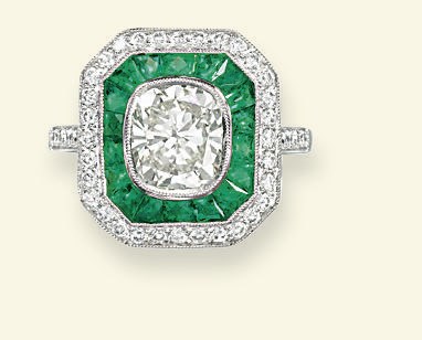 A DIAMOND AND EMERALD PLAQUE RING