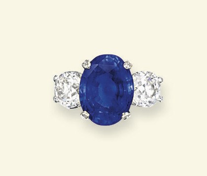 A SAPPHIRE AND DIAMOND THREE-STONE RING