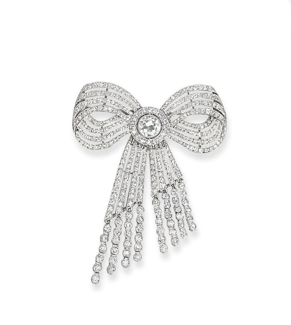 A BELLE EPOQUE DIAMOND BOW BROOCH, BY CARTIER