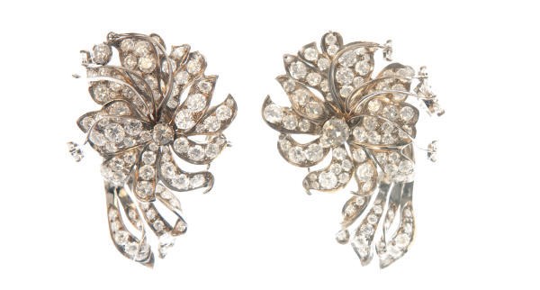 A PAIR OF DIAMOND AND PLATINUM FLOWER EAR CLIPS