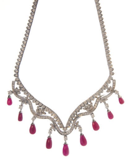 A RUBY, DIAMOND AND WHITE GOLD NECKLACE