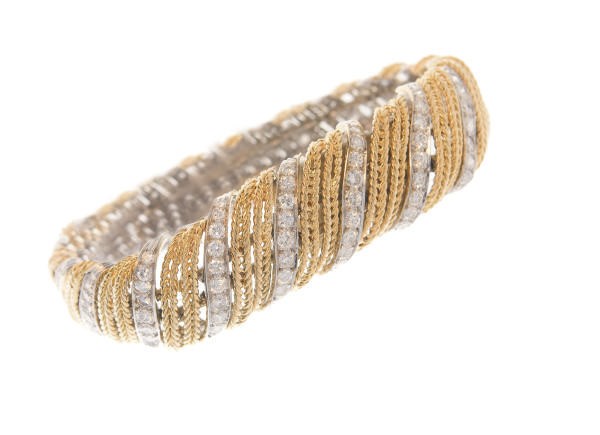 A DIAMOND AND 18K GOLD BRACELET, BY STERLE