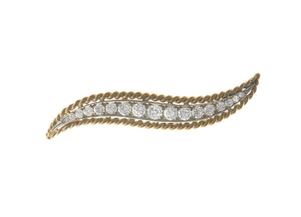 A DIAMOND AND GOLD BROOCH, BY VAN CLEEF & ARPELS