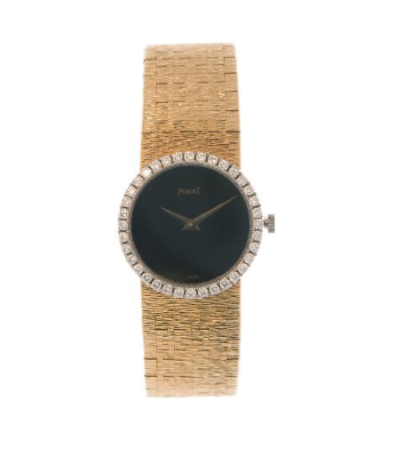 AN ONYX, 18K GOLD AND DIAMOND WATCH, BY PIAGET