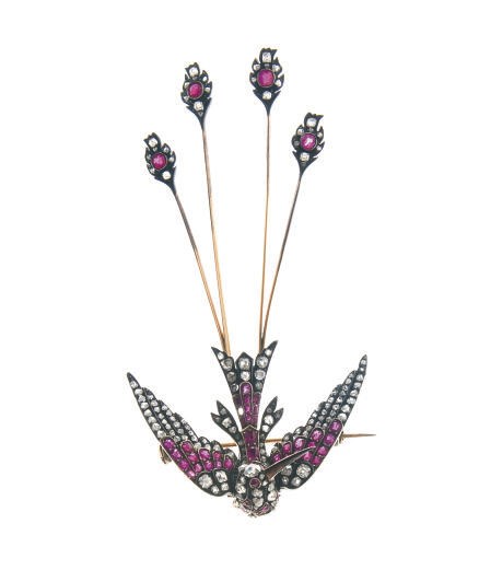 AN ANTIQUE DIAMOND AND RUBY SWALLOW BROOCH