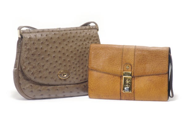 A HELENE ARPELS TAUPE OSTIRCH AND GILT-METAL SADDLE BAG**,