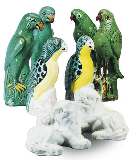 A GROUP OF THREE PAIRS OF CHINESE EXPORT STYLE PARROTS AND A PAIR OF BUDDISTIC LIONS,