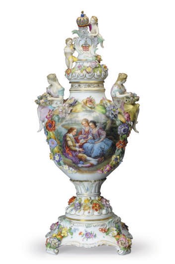 A GERMAN PORCELAIN FLOWER-ENCRUSTED VASE, COVER AND A STAND,