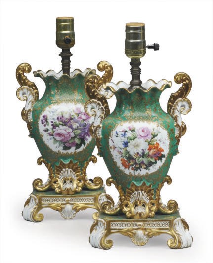 A PAIR OF FRENCH PORCELAIN GREEN-GROUND TWO HANDLED URNS MOUNTED AS LAMPS,