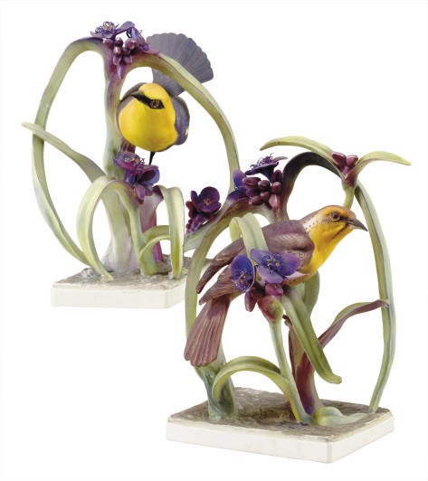 A PAIR OF ENGLISH PORCELAIN MODELS OF YELLOW HEADED BLACKBIRDS IN FLORA,