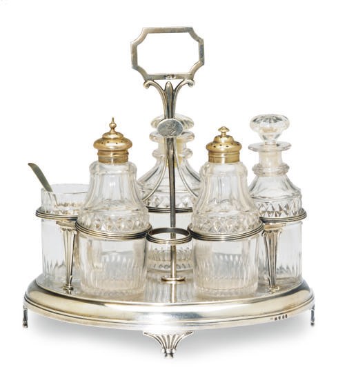 A GEORGE III CRUET STAND AND FIVE LATER CUT GLASS BOTTLES,