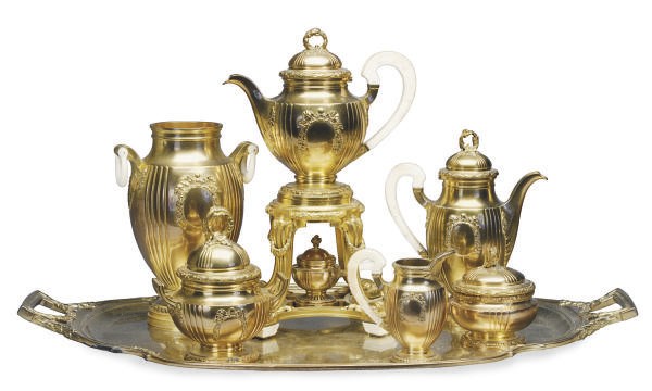 A FRENCH IVORY-MOUNTED SILVER-GILT SEVEN-PIECE TEA AND COFFEE SERVICE,**