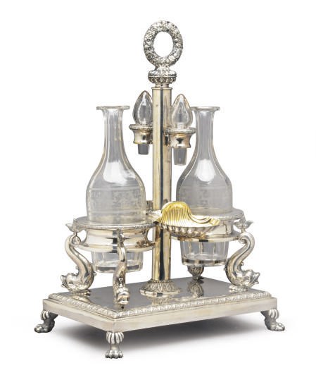 A GERMAN SILVER CRUET STAND WITH TWO GLASS BOTTLES AND STOPPERS,