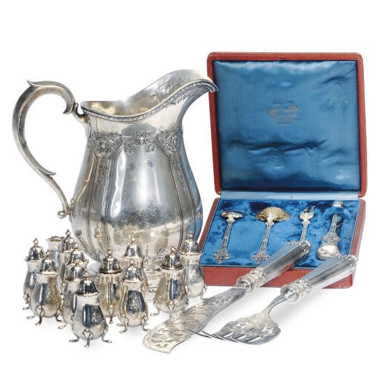A SET OF FRENCH SILVER SERVING UTENSILS, A SET OF TWELVE GEORGE V SILVER CASTERS AND AN AMERICAN WATER PITCHER,