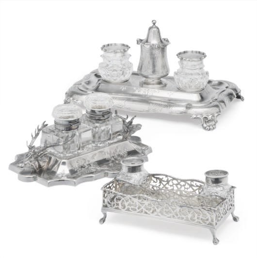 A GEORGIAN SILVER INKSTAND, A VICTORIAN SILVER INKSTAND, AND AN ENGLISH SILVER-PLATED INKSTAND WITH STAG HEAD HANDLES,