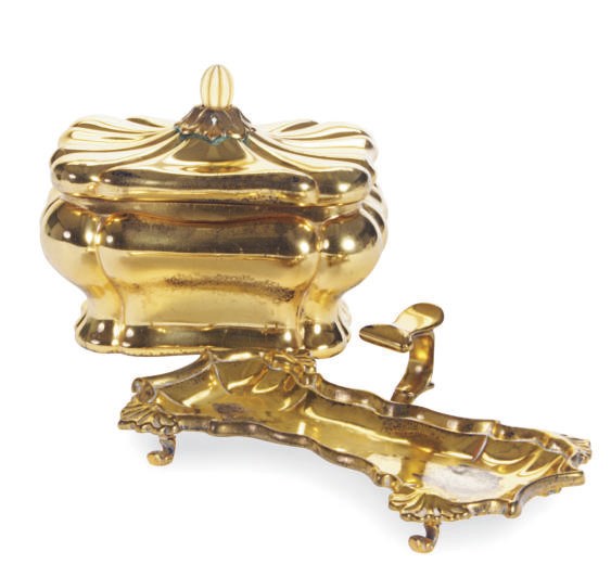 A GEORGE II SILVER-GILT CANDLE SNUFFER TRAY AND A CONTINENTAL SILVER GILT SUGAR BOX,**