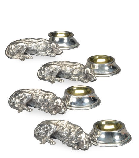 A SET OF FOUR AMERICAN SILVER-PLATED SALTS MODELED AS RETRIEVERS WITH BOWLS,