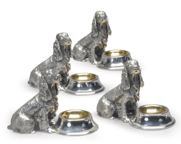A SET OF FOUR AMERICAN SILVER-PLATED SALT CELLARS MODELED AS SEATED SPANIELS WITH BOWLS,