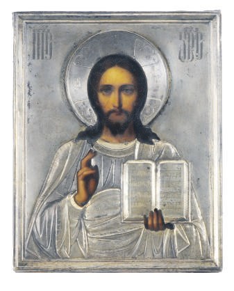 A RUSSIAN ICON OF CHRIST PANTOKRATOR IN BLESSING MOUNTED WITH A SILVER OKLAD,