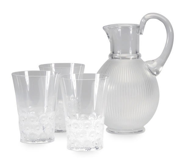 A SET OF TWELVE FRENCH CLEAR GLASS TUMBLERS AND A RIBBED OVOID WATER PITCHER,