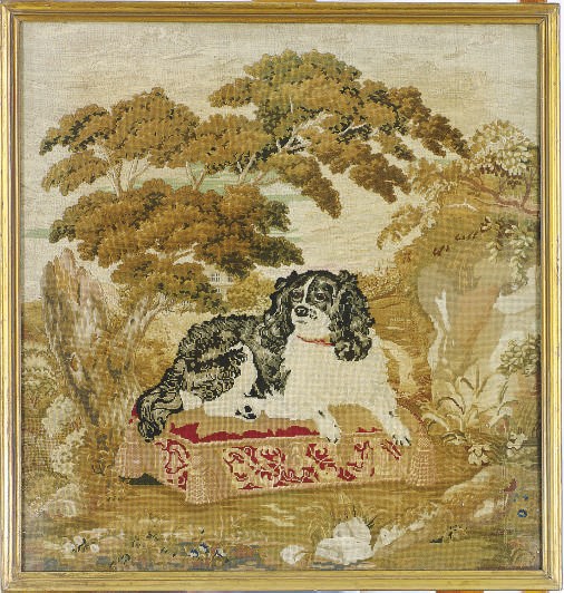 AN ENGLISH NEEDLEWORK OF A SPANIEL,