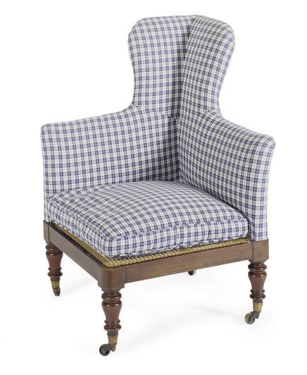 A WILLIAM IV MAHOGANY, CANED AND UPHOLSTERED CORNER ARMCHAIR