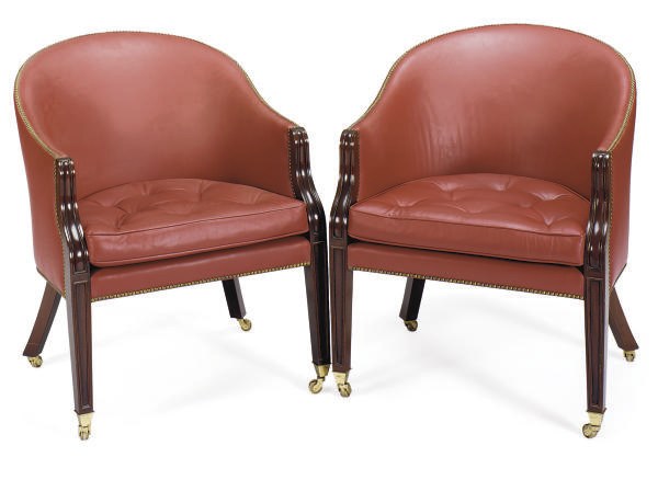 A PAIR OF MAHOGANY AND RED-LEATHER UPHOLSTERED LIBRARY ARMCHAIRS,