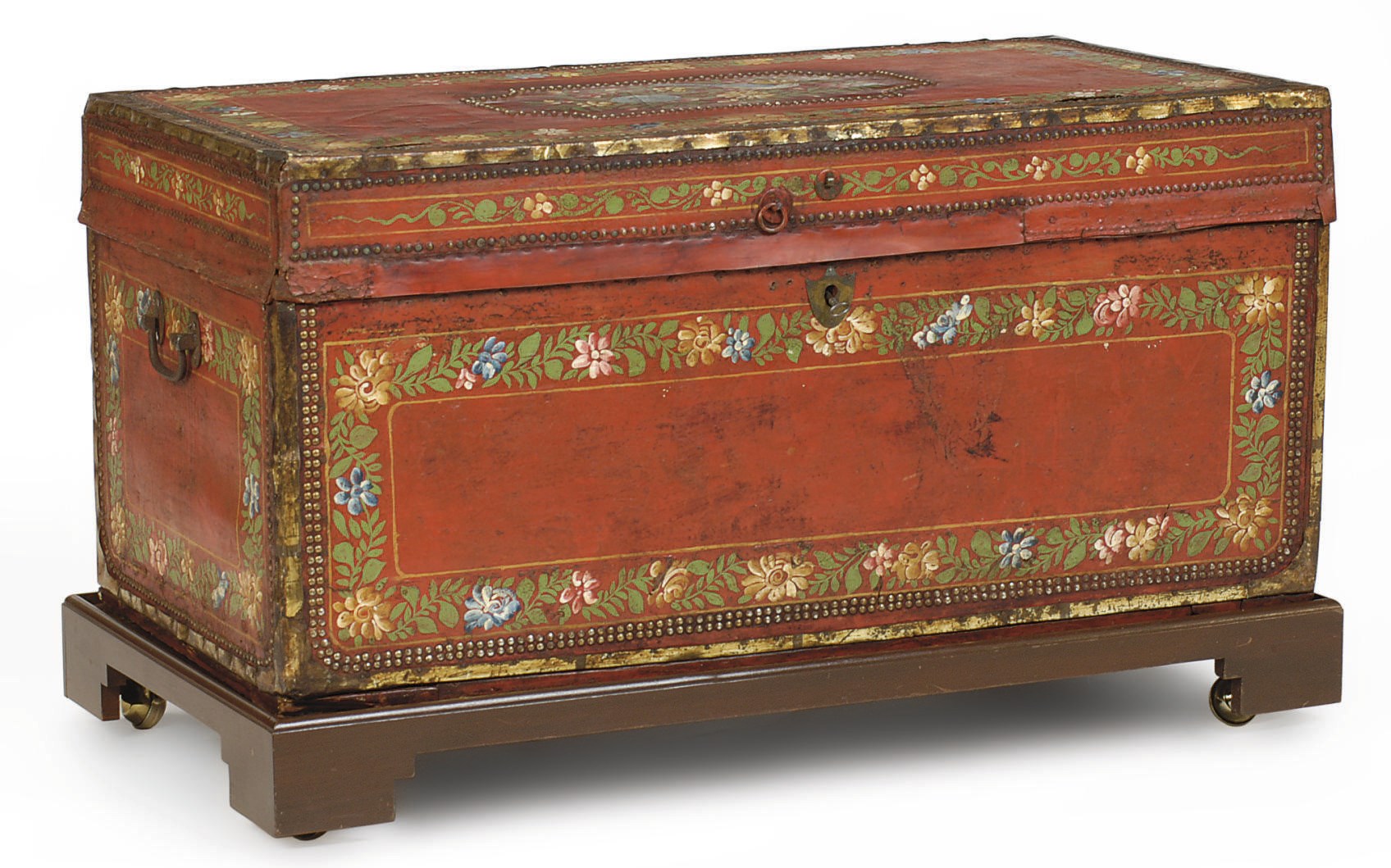 A RED GROUND LACQUERED LEATHER AND POLYCRHOME-PAINTED CHEST ON LATER STAND,