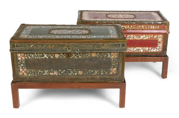TWO LACQUERED AND POLYCRHOME-DECORATED LEATHER CHESTS ON LATER STANDS,
