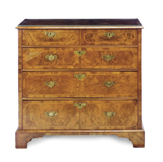 AN ENGLISH WALNUT AND FEATHERBANDED CHEST-OF-DRAWERS,