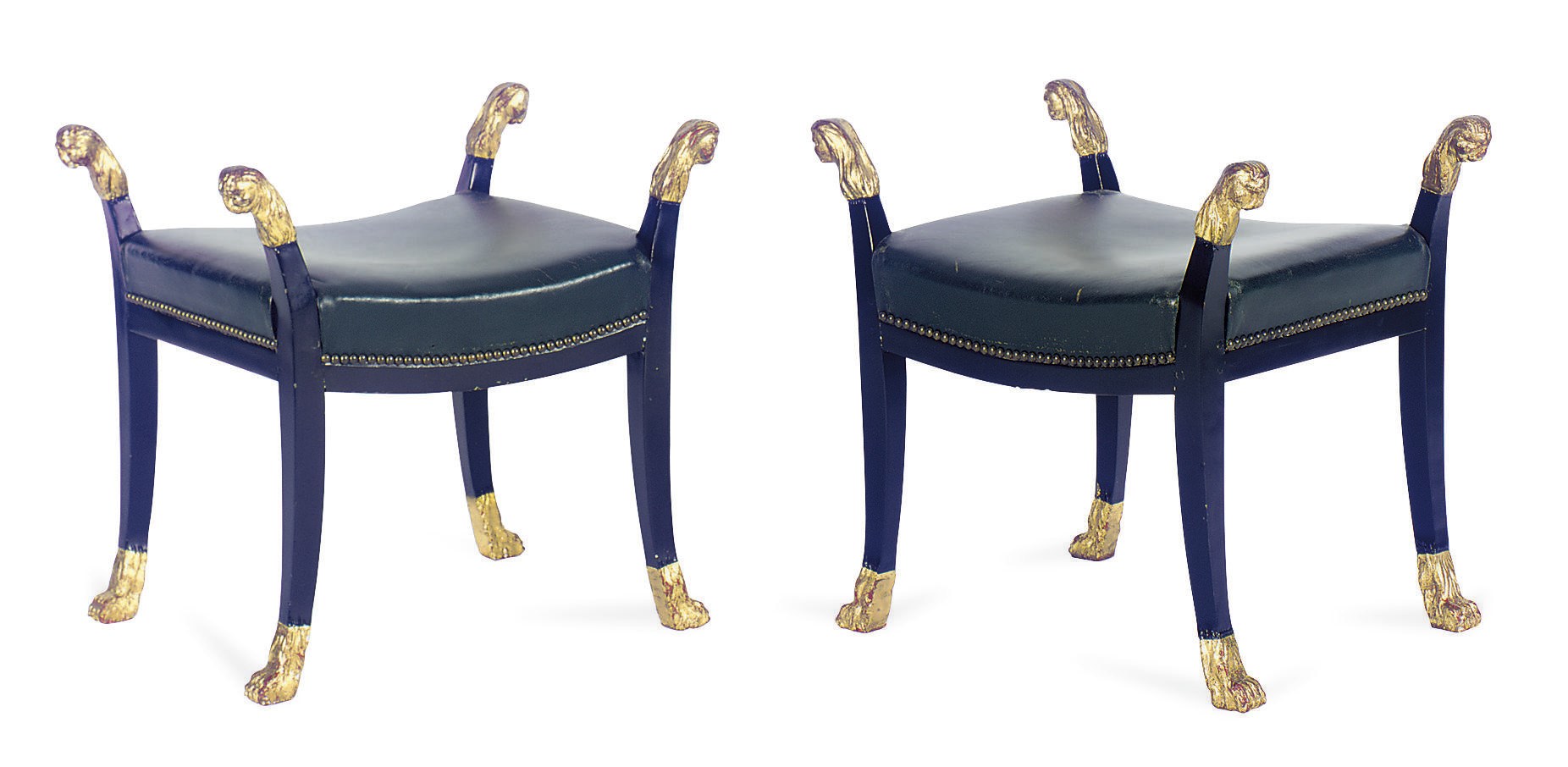 A PAIR OF EBONIZED AND PARCEL-GILT GREEN LEATHER UPHOLSTERED STOOLS,