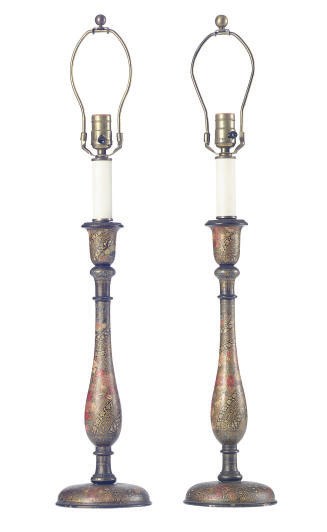 A PAIR OF VICTORIAN EBONIZED AND POLYCHROME-DECORATED CANDLESTICKS LATER MOUNTED AS LAMPS,