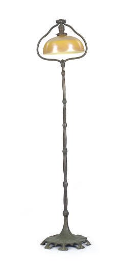 A PATINATED BRONZE AND 'FAVRILE' GLASS FLOOR LAMPS,
