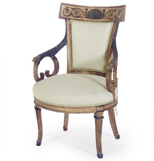 AN ITALIAN PAINTED AND PARCEL-GILT LOW ARMCHAIR,