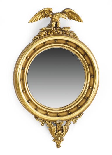 A GILTWOOD FIGURAL CONVEX MIRROR,