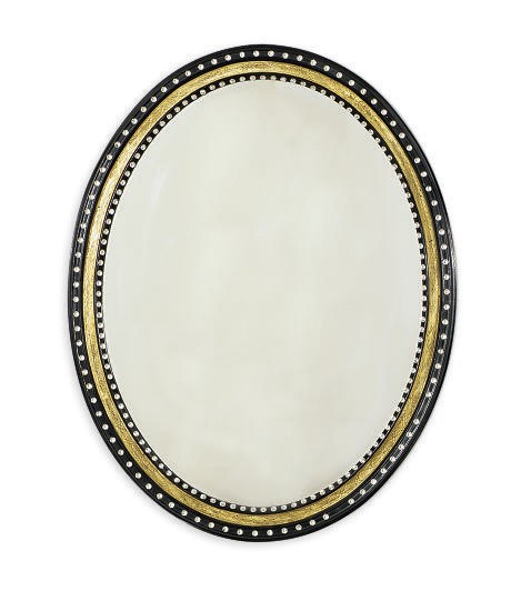 AN OVAL EBONIZED, PARCEL-GILT, AND 'JEWELED' OVAL MIRROR,