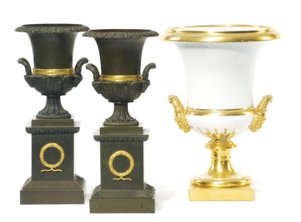 A PAIR OF PATINATED AND GILT-METAL URNS,