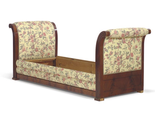 A NORTH EUROPEAN MAHOGANY AND UPHOLSTERED SLEIGH BED,