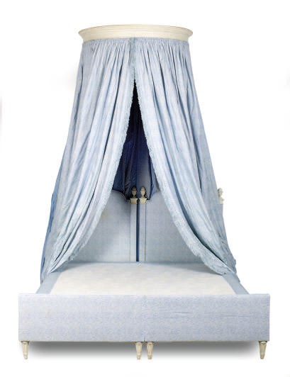 A CREAM-PAINTED AND UPHOLSTERED BED WITH CANAPE,